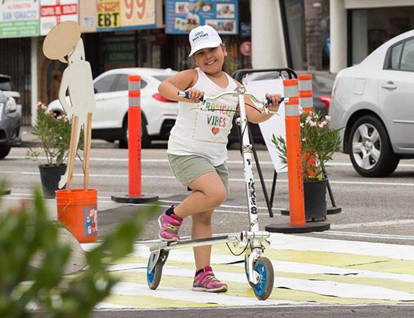 Child riding on a scooter