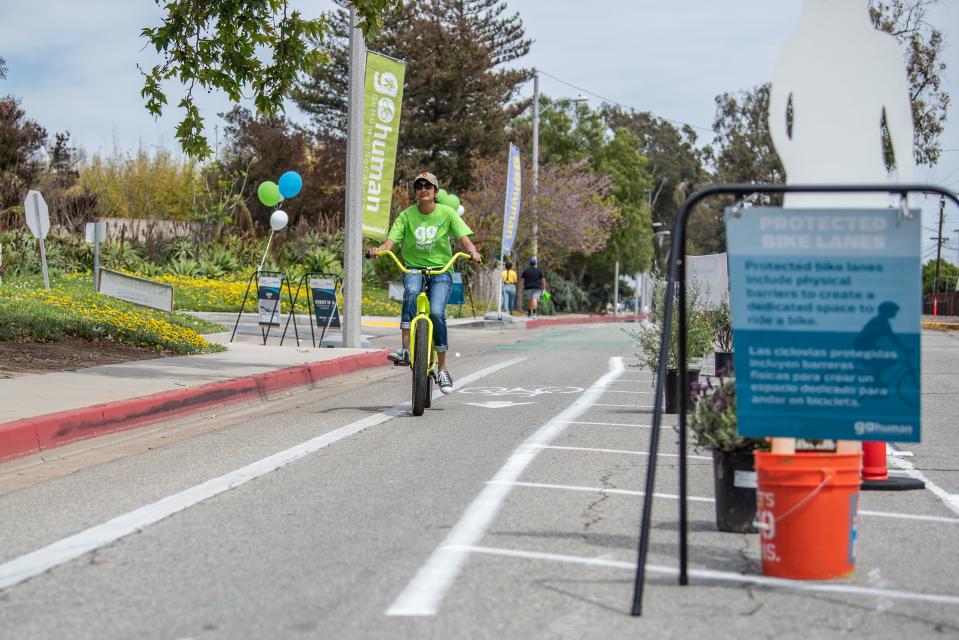 Person riding bike to event