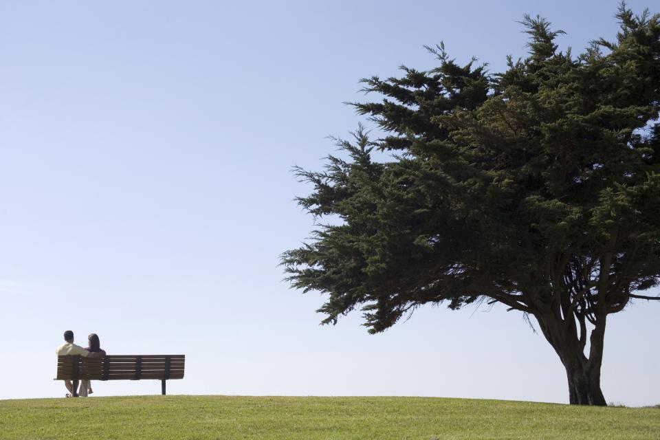 Two people sitting on a bench