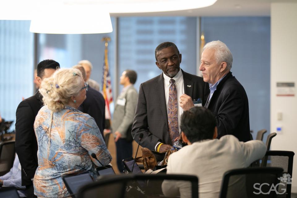 A group of attendees have a discussion during a break in the workshop.